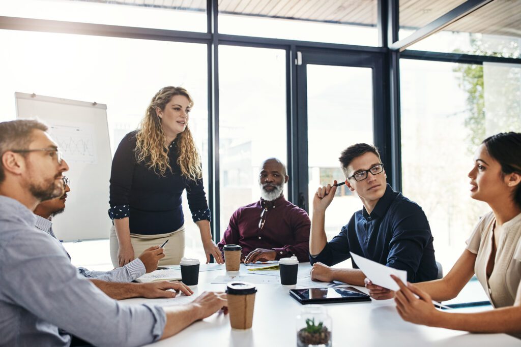 Office workers discussing the election impact