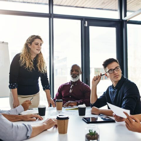 Office workers discussing the election impact