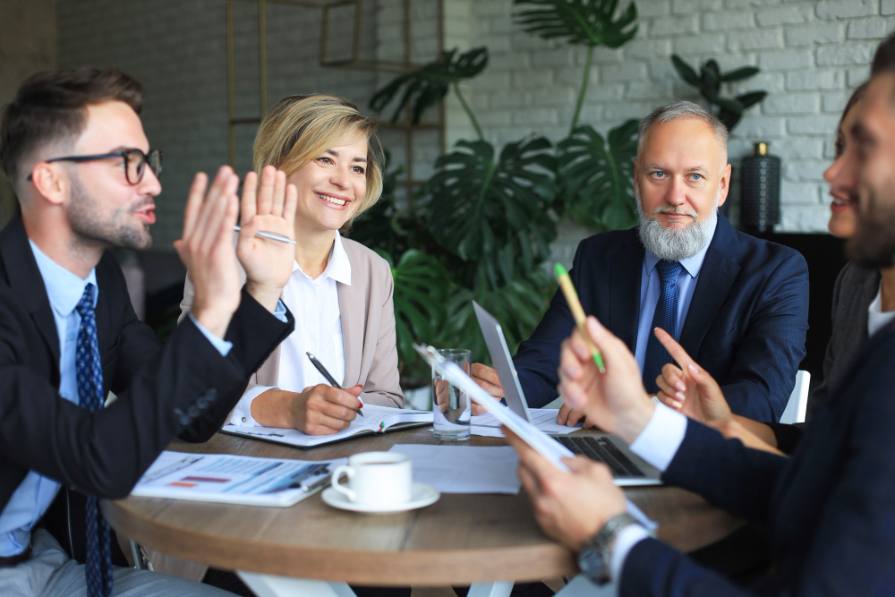 Office workers discussing the election impact