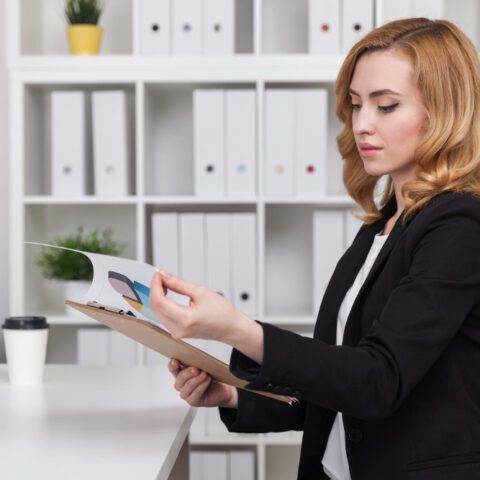 Office professional managing documents and schedules