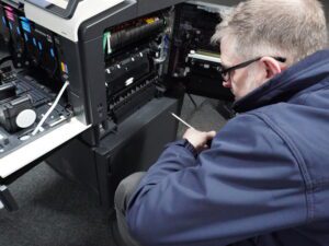 Phil Ritchie servicing a photocopier
