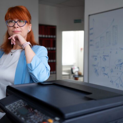 Office copier lifespan: Used copier, hourglass icon, older and newer models. Time to upgrade, maximise efficiency.