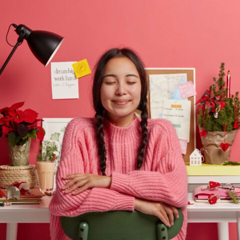 Productivity Habits and Rituals: Calm person at organised desk with free time, showing control and accomplishment.