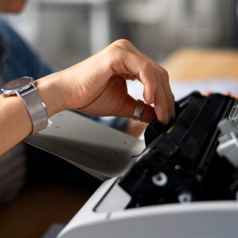 Old photocopier (error light) and a modern lease document highlight high Photocopier costs modern lease and the path to maximise savings.